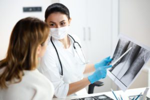 Doctor pointing at xrays