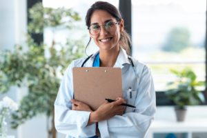 A happy Doctor with stethoscope in clinic