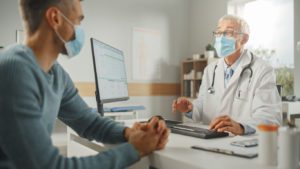 Doctor talking to his male patient