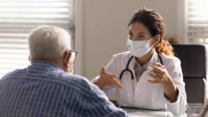 primary care physician Consulting a Old man