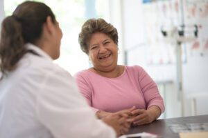 Older Woman talking with the Family Doctor