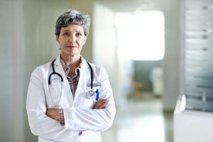 Portrait of a mature female doctor standing