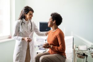 Women's physician reassuring a patient