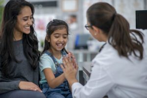 Primary care doctor Giving To a girl patient