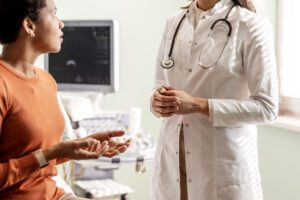 Caring female doctor listens to patient