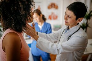 General Practitioner examine the young girl